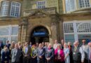 Photograph of staff, volunteers, partners and guests gathered outside the new office of Citizens Advice Hull & East Riding at 6 Manor Street, Bridlington