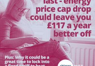 Photograph shows a woman sitting looking at some paper bills with text overlaid: "Good news at last - energy price cap drop could leave you £117 a year better off. "Plus: Why it could be a great time to lock into a fixed tariff to beat gas price hikes, and how we can help you"
